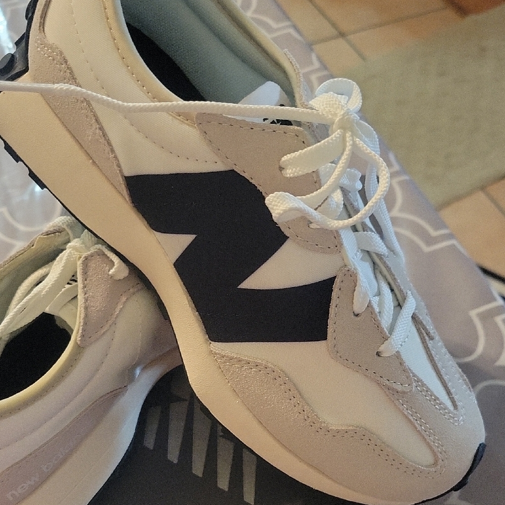 New Balance Cream and Black Sneakers